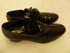 Pair of gentlemen's black patent leather evening shoes, hand-lasted, made in England, probably a