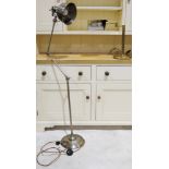 A large modern industrial style angle poise lamp together with a brass adjustable desk lamp.