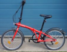 Red painted B-Twin folding bicycle
