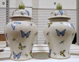 Pair of India Jane vases with covers, decorated with butterflies, dragonflies and beetles, on a