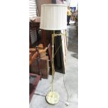 Modern brass reading lamp, adjustable and shade.