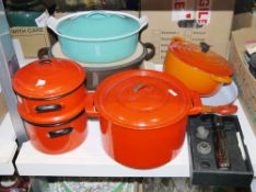 Le Creuset cast iron and turquoise enamel casserole, a Le Creuset cast iron and orange enamel