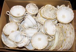Early Victorian part tea/dinner service with gilt decoration on white ground, to include cups,