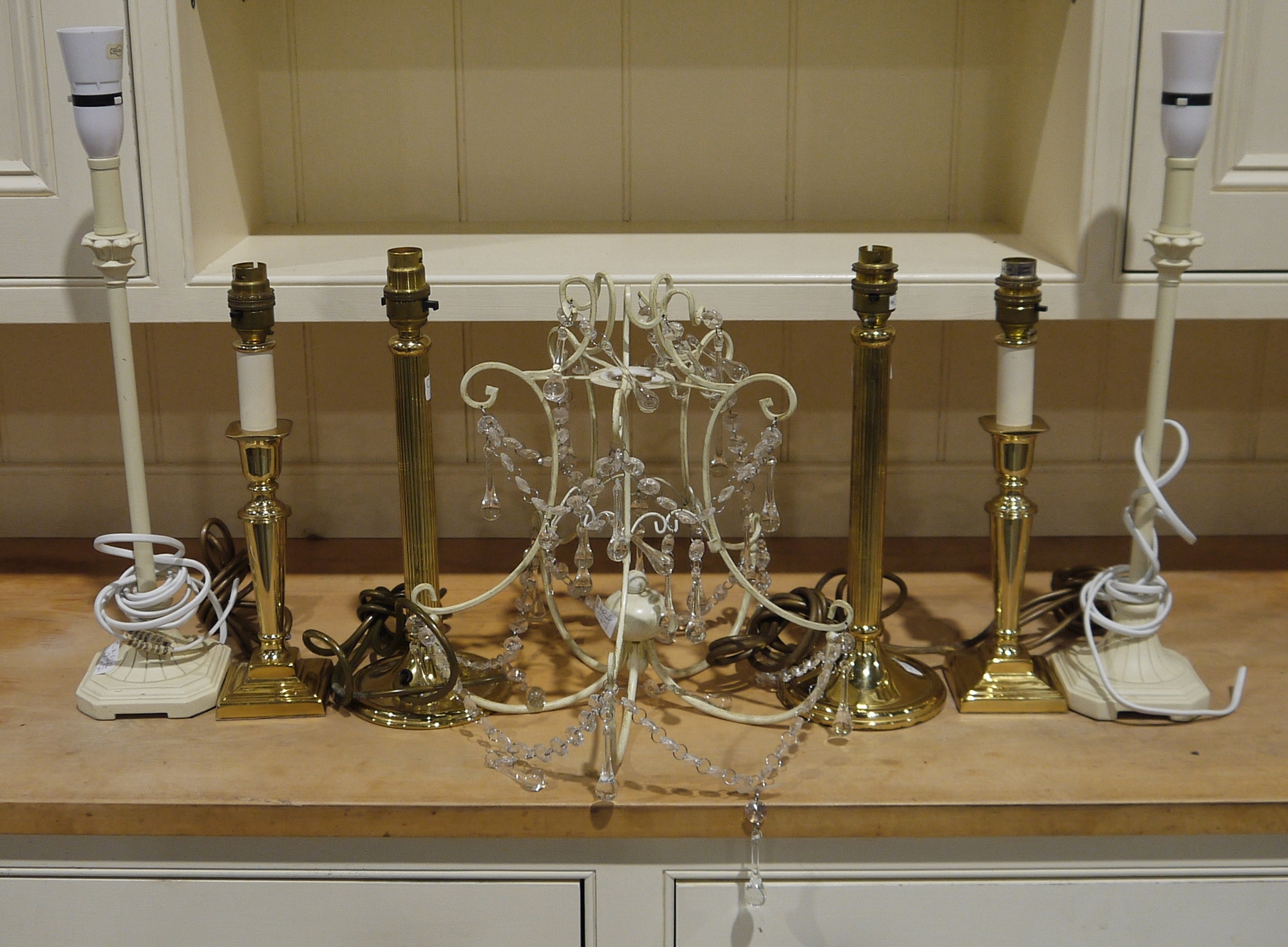 Three pairs of modern table lamps and a wire ceiling light with glass drops