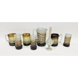 Group of 20th century Persian studio glass, circa 1970s, comprising three tankards, a jug (20cm