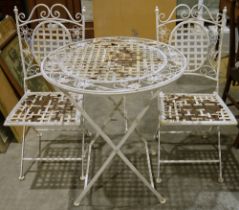 Metal cream painted garden table, circular, decorated with flowers and butterflies, two matching