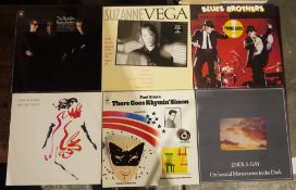 Mixed collection of vinyl LPs including Paul Simon There Goes Rhyming Simon, John Cougar