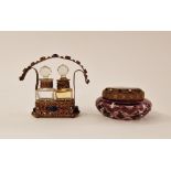 Gilt-metal filigree and 'jewelled' double perfume bottle stand with two cut glass square section
