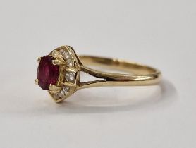 14ct gold ruby and white stone ring, set oval ruby surrounded by small diamonds in elliptical