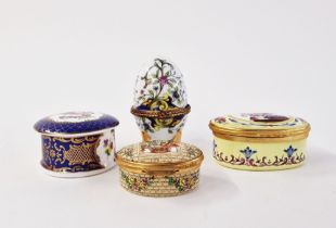 Collection of porcelain and enamel snuff and pill boxes, including an egg-shaped Limoges-style box