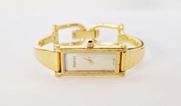 Lady's Gucci 1500L wristwatch having a rectangular mother-of-pearl dial, on gold-coloured