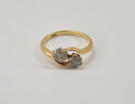 18ct gold and diamond twin-flowerhead cluster crossover ring, gross weight 2.75g, ring size M