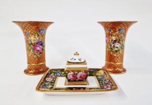Pair of French porcelain trumpet-shaped vases painted with bouquets of flowers on a gilt scale-