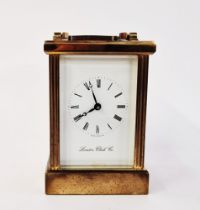 20th century brass carriage clock by the London Clock Company, with swing handle and bevelled