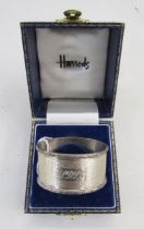20th century silver napkin ring, oval form with engine turned decoration, hallmarked Birmingham