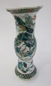 A Chinese famille verte Gu shaped vase and a pair of Japanese porcelain vases, the first probably
