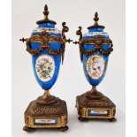 Pair of French Sevres-style gilt metal-mounted porcelain vases with fixed covers, circa 1900, from a