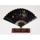 19th century Canton black lacquer and painted paper fan in lacquered box, painted with flowers,