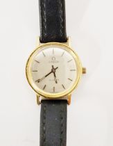 Lady’s Omega rolled gold wristwatch with baton numerals and leather strap