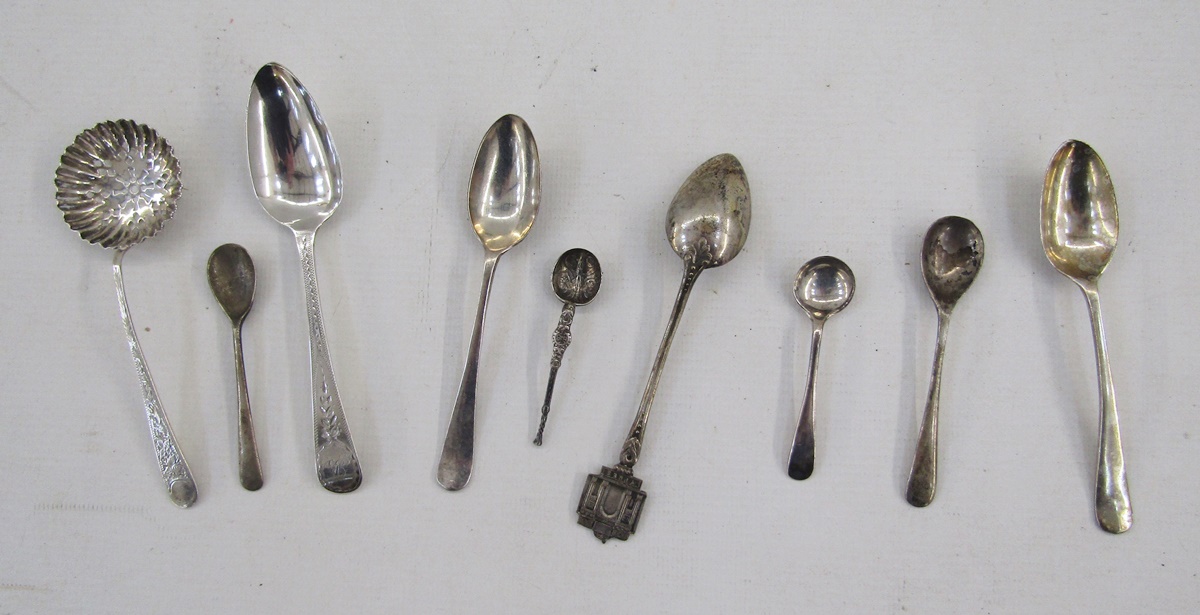 Three various silver teaspoons, a silver sugar sifting spoon, a pair of Irish Victorian silver