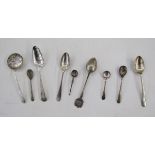 Three various silver teaspoons, a silver sugar sifting spoon, a pair of Irish Victorian silver
