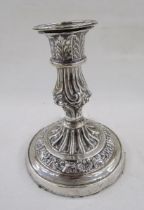 White metal single candlestick, with embossed acanthus leaf and scallop shell decoration,