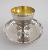 George V silver egg cup on pedestal base, with similar spoon, the egg cup hallmarked London 1923, by