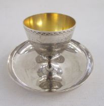 George V silver egg cup on pedestal base, with similar spoon, the egg cup hallmarked London 1923, by