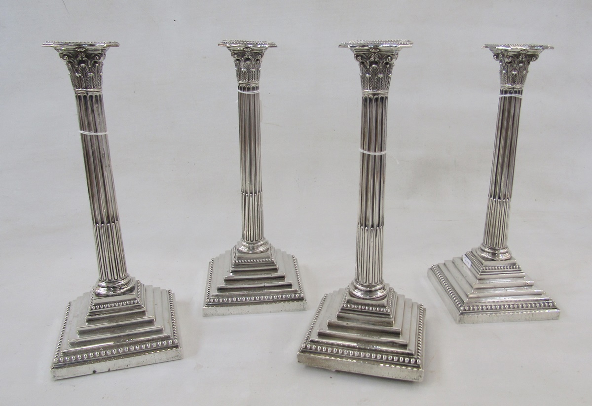 Set of four large Victorian silver candlesticks by Frederick Elkington, Corinthian columns on