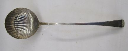 Georgian silver sauce ladle, the bowl shaped as a scallop shell, bright cut handle, hallmarks