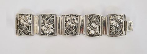 Early Georg Jensen-style silver-coloured metal bracelet of five hinged panels, panels of fruiting