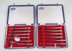 Set of six silver handled dessert forks and knives, in original fitted boxes
