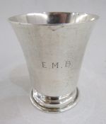 Silver parcel-gilt whisky tot of inverse bell-shape, a footed condiment pot, Birmingham assay, and a