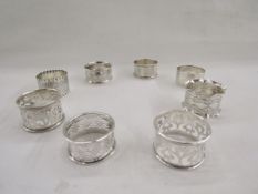 Collection of eight silver napkin rings, of varying designs including pierced, gross weight