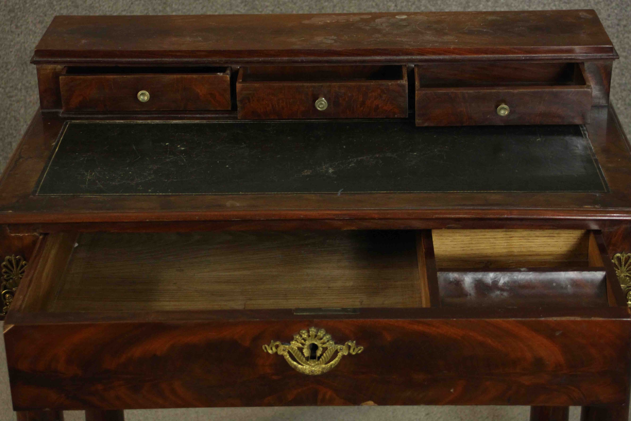 A French Empire flame mahogany writing table, the superstructure with three short drawers, over a - Image 6 of 9