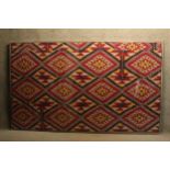 A very large glazed 19th century Uzbekistanian Ikat dyed silk warp with red silk weft. Label