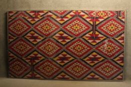 A very large glazed 19th century Uzbekistanian Ikat dyed silk warp with red silk weft. Label