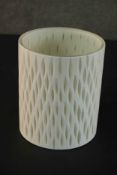 A Terence Conran white glass vase, of cylindrical form with a lattice design to the sides, label