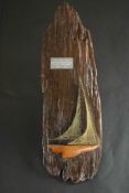 A mid century driftwood plaque with a string art schooner and metal dedication plaque. H.60 W.20cm.