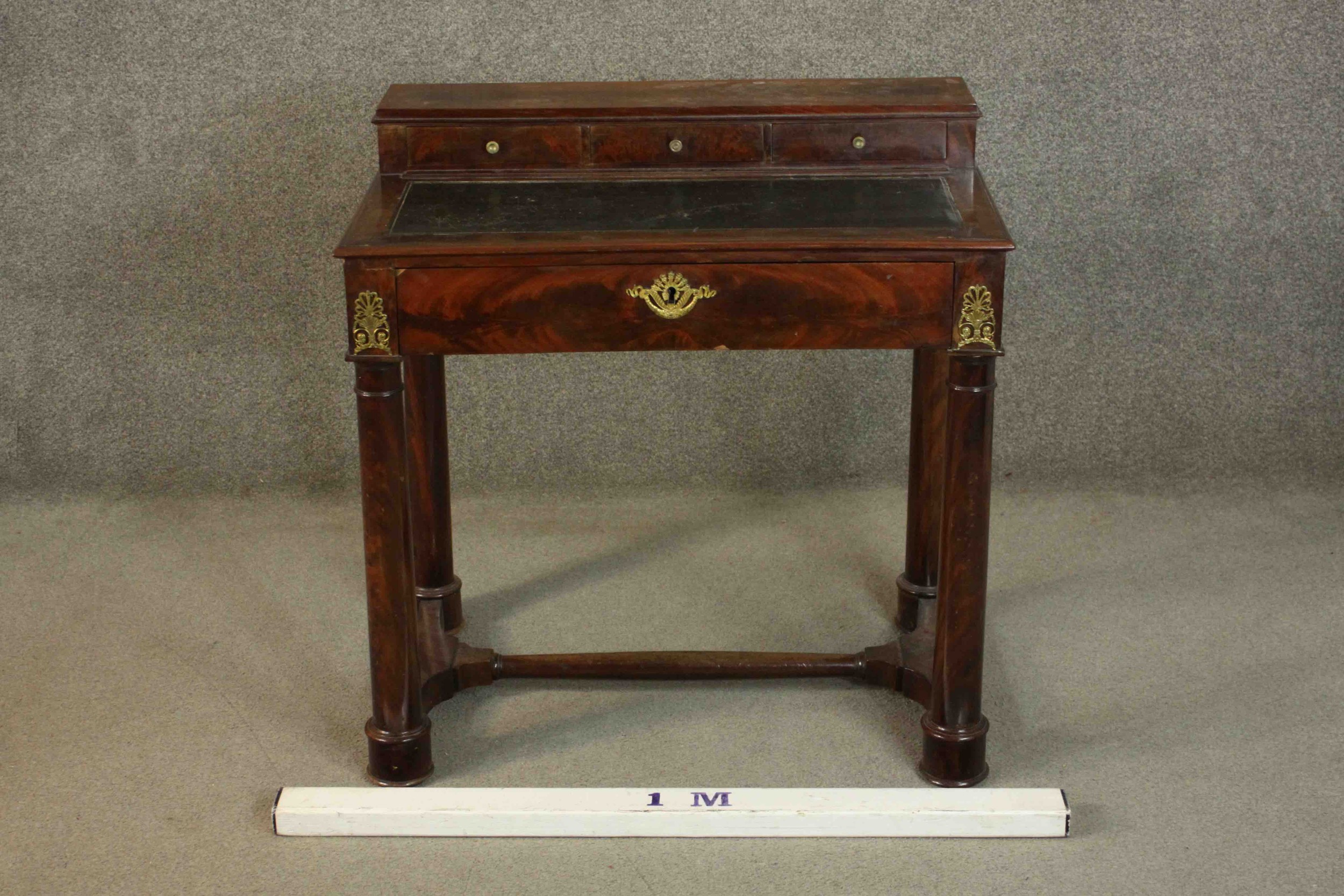 A French Empire flame mahogany writing table, the superstructure with three short drawers, over a - Image 2 of 9