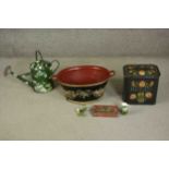 A collection of 20th century toleware items, including a bread bin with floral design, twin