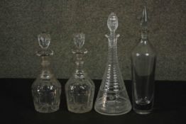 A pair of 19th century hand cut crystal decanters along with a 19th century decanter with slender