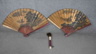 Two large Japanese hand painted gilded fans with landscape design along with a bone, horsehair and