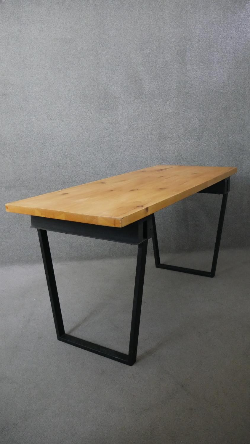A contemporary pine planked top dining table on metal trestle supports. H.83 W.174 D.72cm - Image 5 of 5