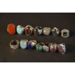 A collection of fourteen gem set and silver rings, set with tiger's eye, ruby, malachite, carnelian,