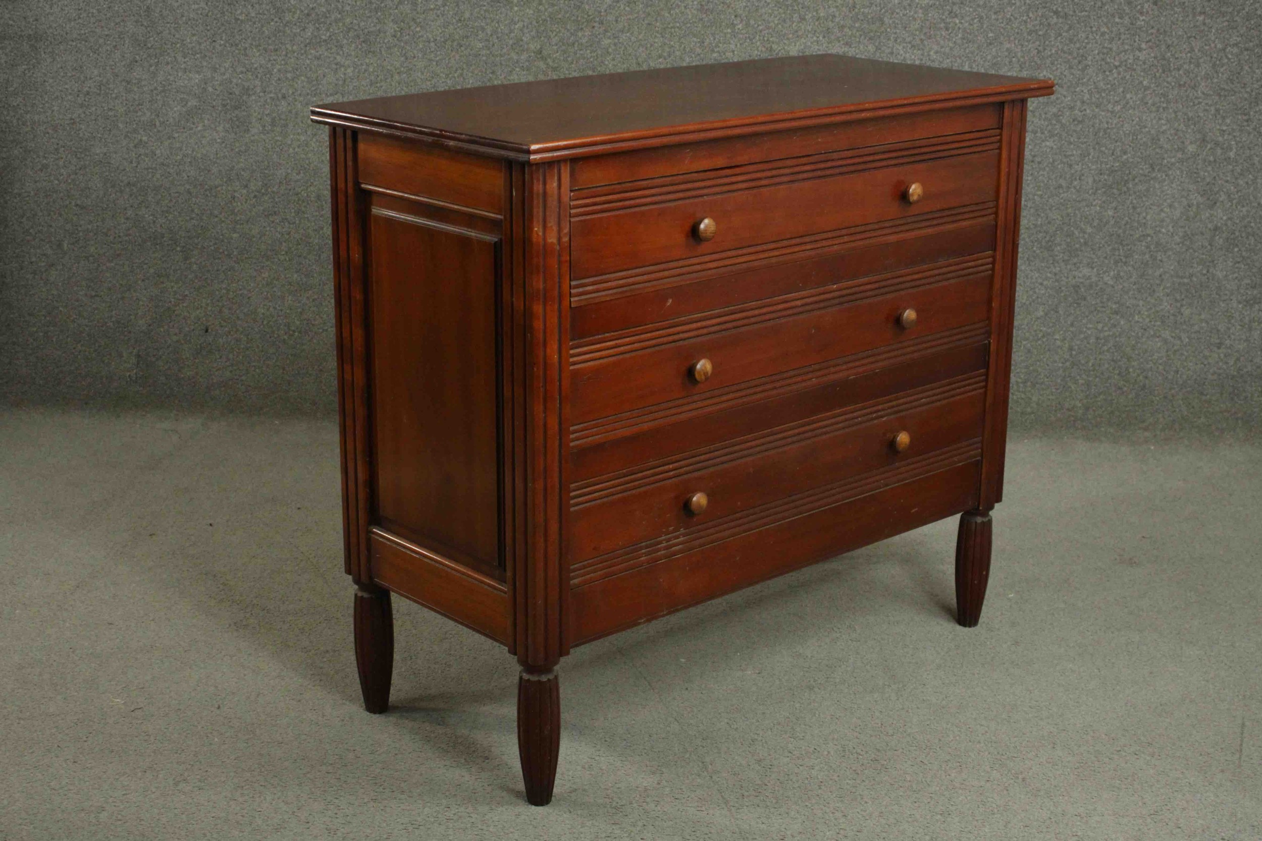A late Victorian style hardwood chest of three long drawers with knob handles and fluted bands, on - Image 3 of 6