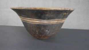 A large tribal carved bowl with engraved linear detailing. Dia.40cm.