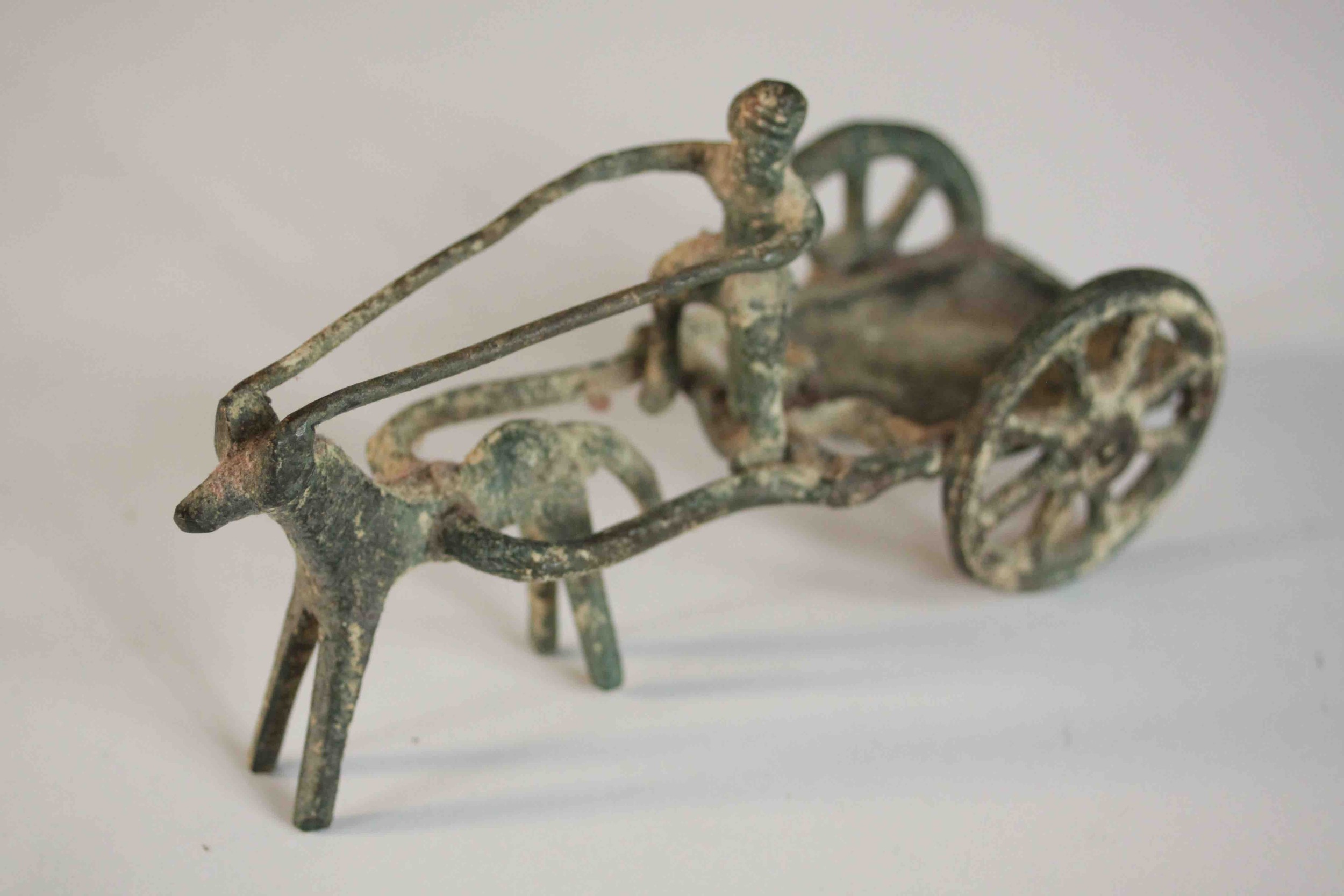 An ancient Greek style bronze of a man riding a horse drawn cart. H.8 W.14 D.6cm. - Image 5 of 8