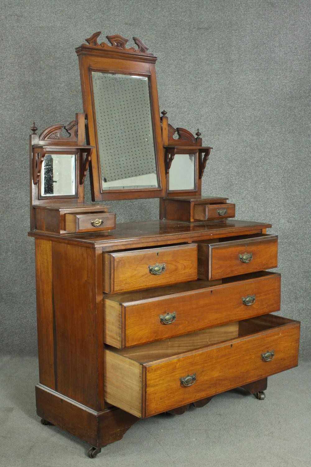 A late Victorian walnut dressing chest, with a central bevelled swing frame mirror, flanked by two - Image 4 of 11