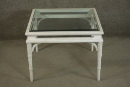 A contemporary white painted and distressed ash coffee table, of square form with a plate glass